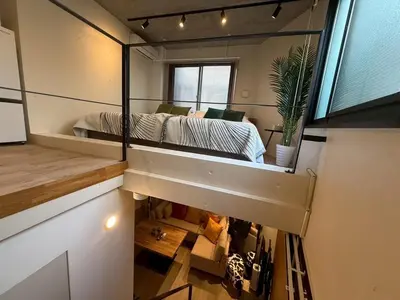a bedroom in a tiny house with a bed at Tkm\u767d\u91d15\u4e01\u76ee in Tokyo