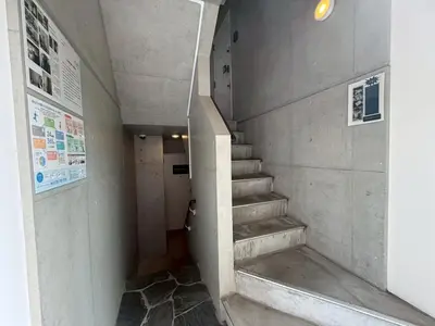 a stairway in a building with a stair case at Tkm\u767d\u91d15\u4e01\u76ee in Tokyo