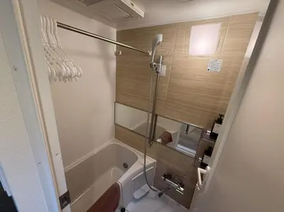 a bathroom with a bath tub and a shower at Tkm\u767d\u91d15\u4e01\u76ee in Tokyo