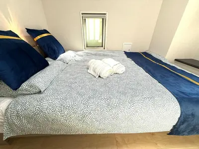 a large bed with two rolled towels on it at SELENTE-S3 - Tokyo Tower 2BR - Central Tokyo in Tokyo