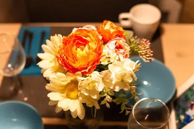 a bouquet of flowers in a vase on a table at Imb\u753a\u5c4b4\u4e01\u76ee302 in Tokyo