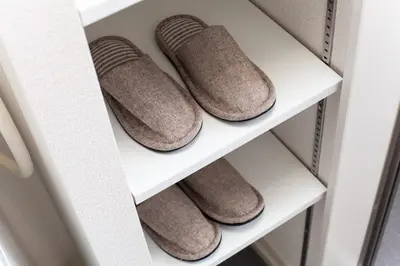 a row of brown shoes on a shelf in a refrigerator at Imb\u753a\u5c4b4\u4e01\u76ee302 in Tokyo