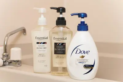 three bottles of personal care products sitting on a bathroom sink at Imb\u753a\u5c4b4\u4e01\u76ee302 in Tokyo
