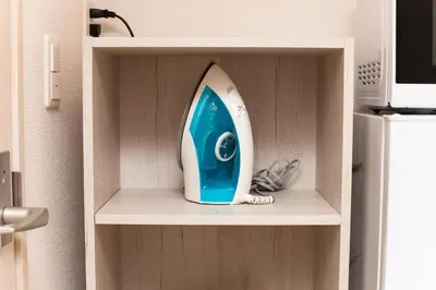 a blue and white surfboard sitting on a shelf at Imb\u753a\u5c4b4\u4e01\u76ee302 in Tokyo