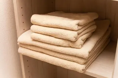 a pile of towels sitting on a shelf at Imb\u753a\u5c4b4\u4e01\u76ee302 in Tokyo