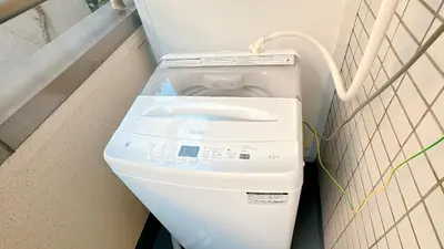 a washing machine in a bathroom in a room at SAKURA HOUSE 206, Sakura Shinmachi St 2 min walk, Shibuya 10 min, Free WiFi in Tokyo