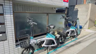 two scooters parked on the side of a building at SAKURA HOUSE 206, Sakura Shinmachi St 2 min walk, Shibuya 10 min, Free WiFi in Tokyo