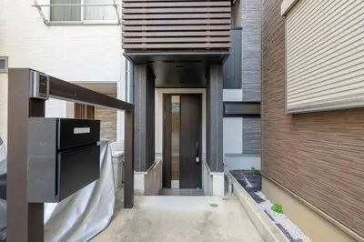 a house with a walkway leading to a door at -Baba 3chome- 8-minute walk from Takadanobaba station in Tokyo