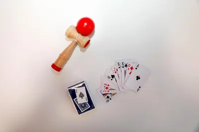 a table with a gavel and a pile of playing cards at Kaga house1 in Tokyo