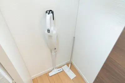 a white urinal hanging on a white door at The House IKEBUKURO 301 in Tokyo