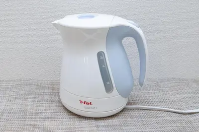 a white tea kettle sitting on top of a table at The House IKEBUKURO 301 in Tokyo