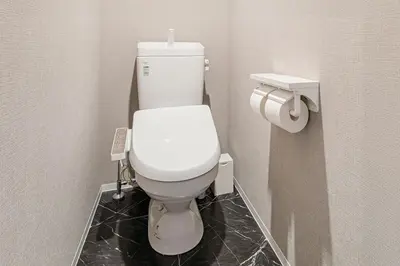 a bathroom with a white toilet in a stall at Casa-T\u4e94\u53cd\u91ce in Tokyo