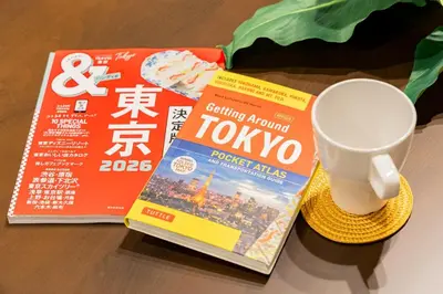 a cup of coffee next to a book and a cup of tea at Lino Stay Kasai 'elua in Tokyo