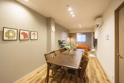 a dining room with a table and chairs at Lino Stay Kasai 'elua in Tokyo