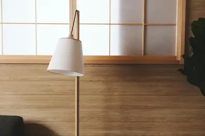 a white floor lamp in a room with wooden floors at Ebisu4HOTEL in Tokyo