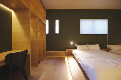 a small room with two beds and a window at Ebisu4HOTEL in Tokyo