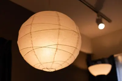 a white paper lantern hanging from a ceiling at Imb\u753a\u5c4b4\u4e01\u76ee201 in Tokyo
