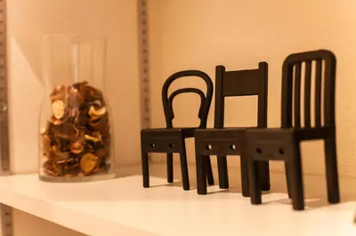 two black chairs and a vase on a shelf at Imb\u753a\u5c4b4\u4e01\u76ee201 in Tokyo