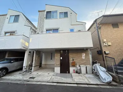 a house with a car parked in front of it at Higashijūjō, Kita City house KI0321 in Tokyo