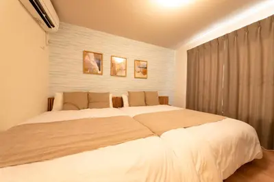 a bedroom with a large white bed in a room at HOTEL Grand Star TATEISHI SEVEN in Tokyo