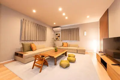a living room with a couch and a table at HOTEL Grand Star TATEISHI SEVEN in Tokyo