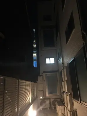 a view of the eiffel tower at night at Shitamachi Base in Tokyo