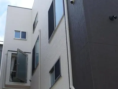 a building with windows on the side of it at Shitamachi Base in Tokyo