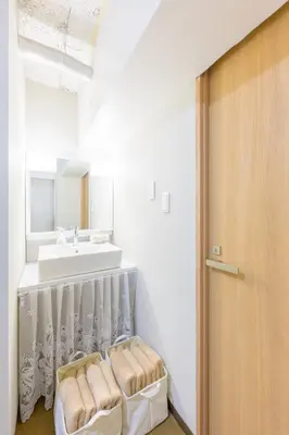 a bathroom with a sink and a mirror at HANEZORA HOTEL itabashi 3F4F in Tokyo