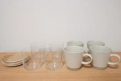 a group of cups and plates on a table at All Good Stay KAMEARI in Tokyo
