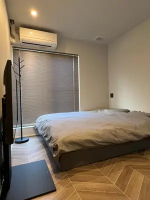 a bedroom with a bed and a large window at Koenji house, 2 bedrooms 2F 47m2, 5 min to Shinjuku in Tokyo