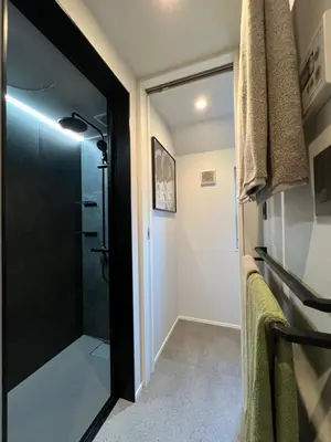 a bathroom with a shower and a glass door at Koenji house, 2 bedrooms 2F 47m2, 5 min to Shinjuku in Tokyo