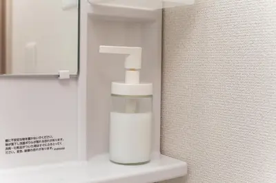 a bathroom with a soap dispenser on a sink at Imb\u753a\u5c4b4\u4e01\u76ee301 in Tokyo