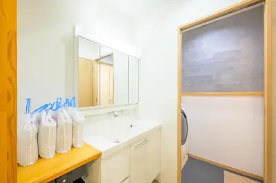 a bathroom with a sink and a mirror at HANEZORA HOTEL itabashi 1F in Tokyo