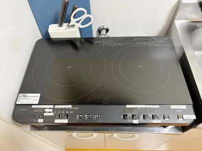a laptop computer sitting on top of a counter at TOKYONATIVES Kugahara Base in Tokyo