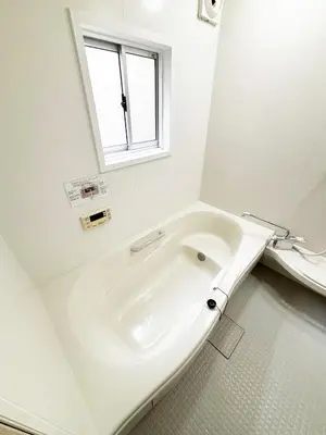 a white sink in a bathroom with a window at TOKYONATIVES Kugahara Base in Tokyo
