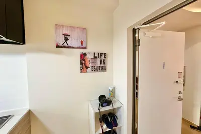 a room with two pictures on the wall and a door at Direct Skytree View I Easy Airport Access I New 2025 Building in Tokyo