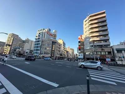 a busy city street with cars and buildings at Direct Skytree View I Easy Airport Access I New 2025 Building in Tokyo
