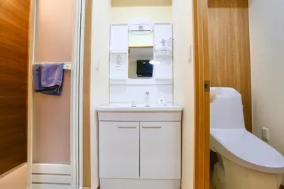a small bathroom with a sink and a toilet at Direct Skytree View I Easy Airport Access I New 2025 Building in Tokyo