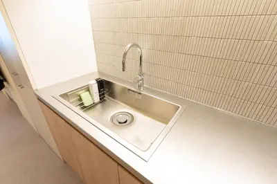a bathroom with a sink with a faucet at THE AKI Daimon in Tokyo