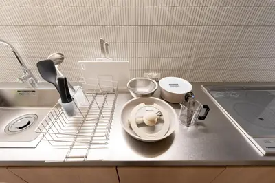 a kitchen counter with a plate and a sink at THE AKI Daimon in Tokyo