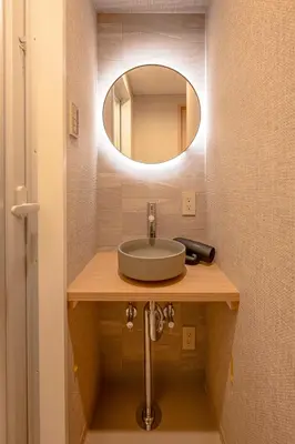 a bathroom with a sink and a mirror at 52A Kikyou NEW OPEN3 minutes from Ayase Station East Exit Modern Welcome to the family of students taking exams Private room rental 20 minutes to Ueno Asakusa in Tokyo