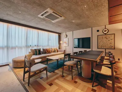 a living room with a couch and a table at illi Nuto Shinjuku in Tokyo