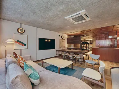 a living room with a couch and a table at illi Nuto Shinjuku in Tokyo
