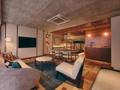 a living room with a couch and a table at illi Nuto Shinjuku in Tokyo