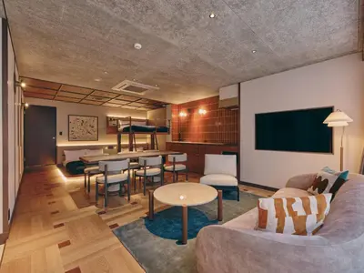 a living room with a couch and a table at illi Nuto Shinjuku in Tokyo