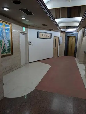 a hallway with a large room with a painting on the wall at 43 MatsuriNewly Opened 3 minutes from Ayase Station East Exit Jpanese modern Sophisticated space Private room Ueno and Asakusa 20 minutes in Tokyo