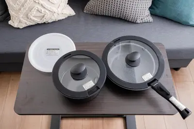 a coffee table with a plate and a microphone on it at Alley Tateishi in Tokyo
