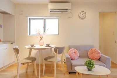 a living room with a couch and a table at Negishi 301-TT0030 in Tokyo