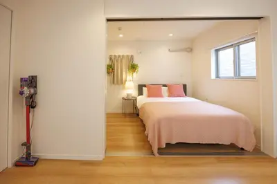 a bedroom with a bed and a window at Negishi 301-TT0030 in Tokyo