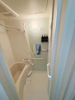 a small bathroom with a tub and a sink at SkyTree View Hikifune Home 1F-105 2min walk to station in Tokyo